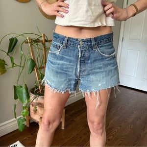 Vintage LEVI’s denim shorts. W30. Raw hem/ distressed. Crotch patch. (See pics)